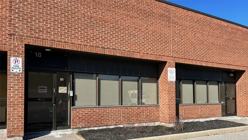 External view of the AESSEAL Etobicoke office, a red brick building.