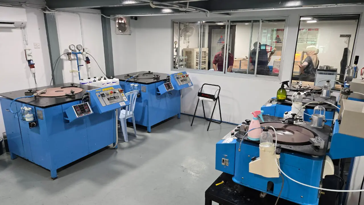 Manufacturing room with cleaning supplies.