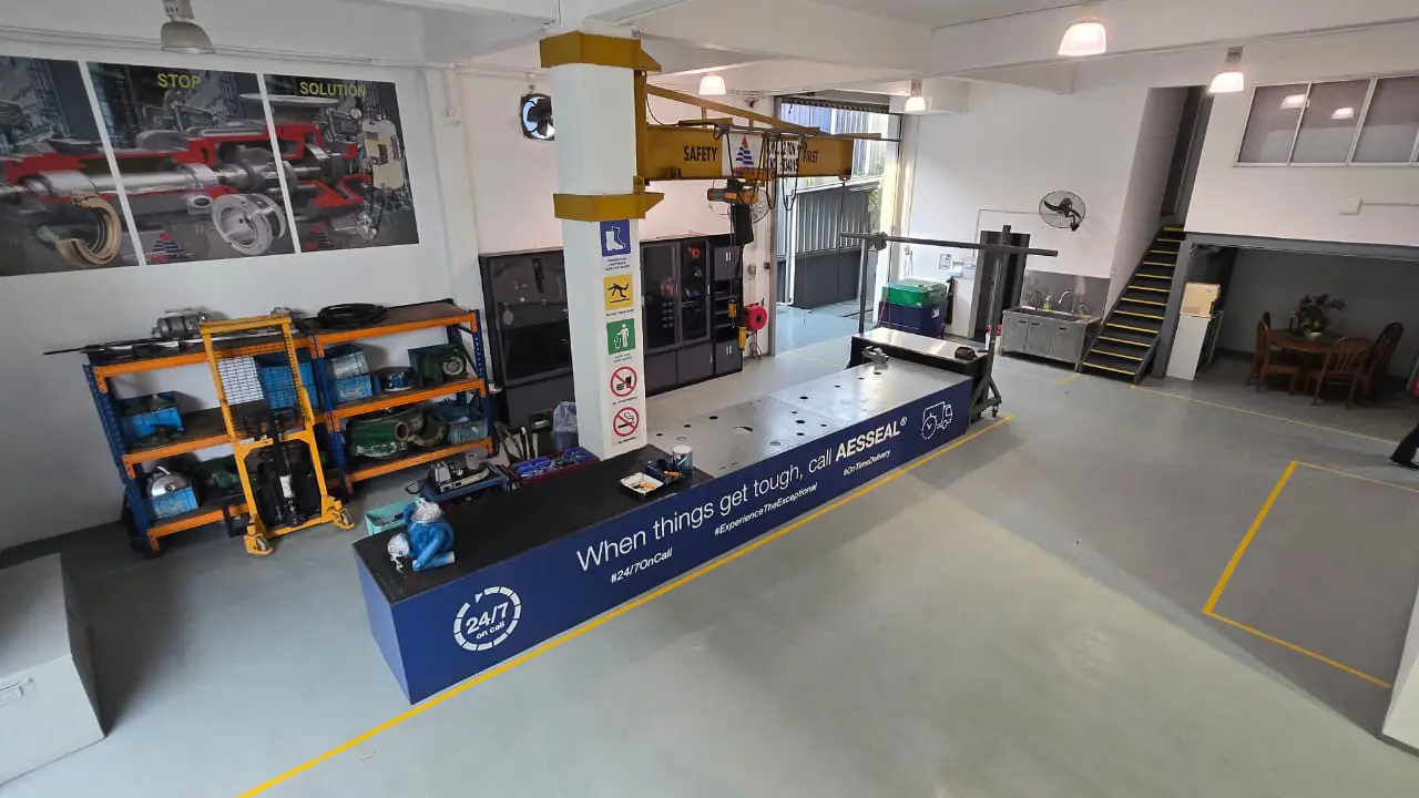 Manufacturing area with a large testing machine.
