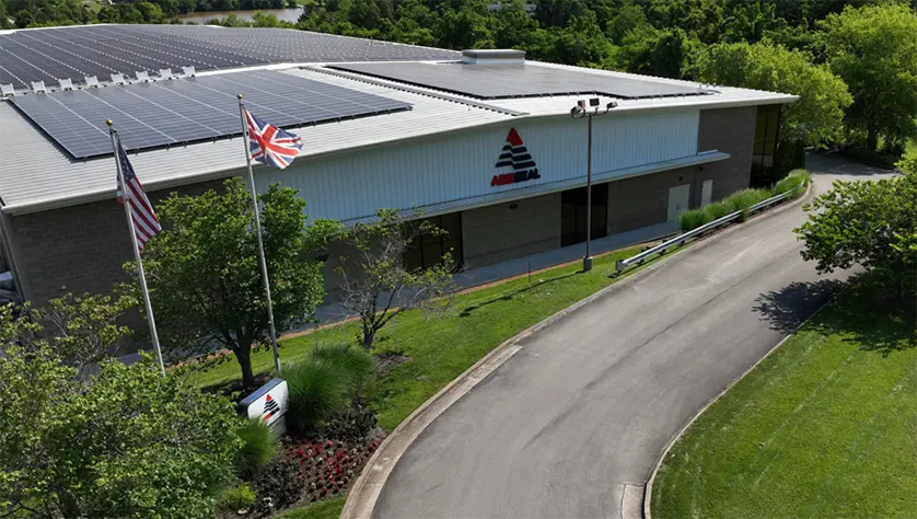 Entrance to AESSEAL Rockford premises with US flag and Union Jack flying.