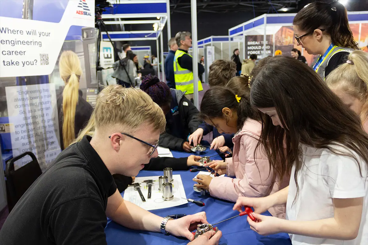 AESSEAL employee building seals with local school children