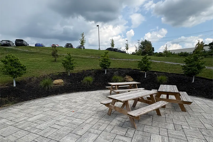 Picnic tables in a paved circle.