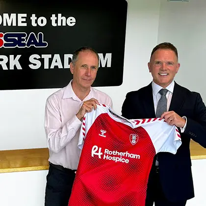left to right: AESSEAL communications manager Andrew Mosley and Rotherham United commercial director Steve Coakley with the new club first team shirt